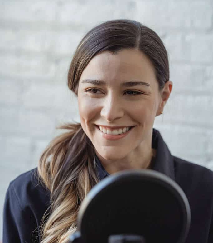 Young woman in an audio recording session