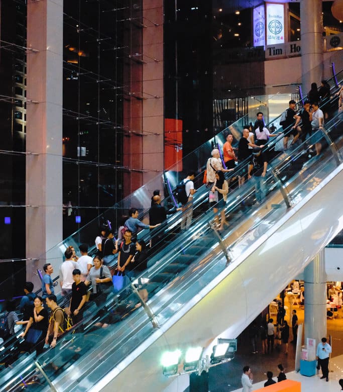 People on an escalator representing the market for products
