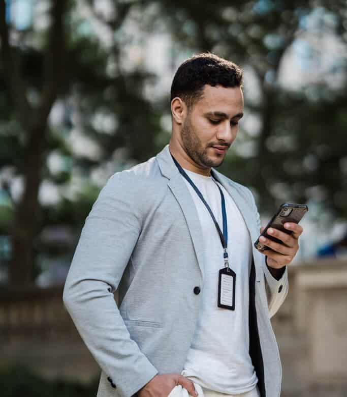 Man looking at social media on mobile phone