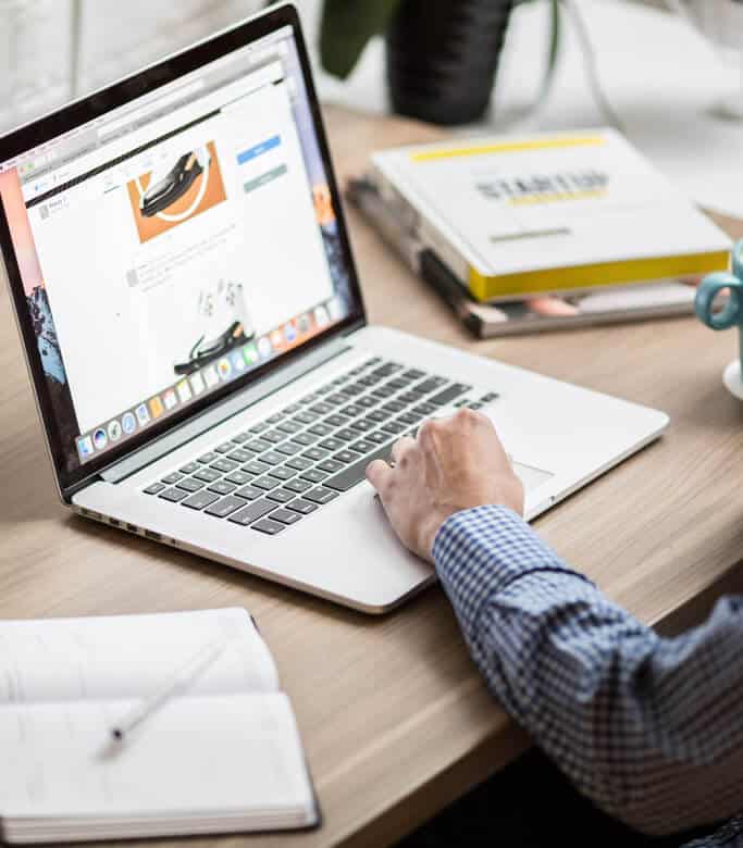 Man using a website on a laptop