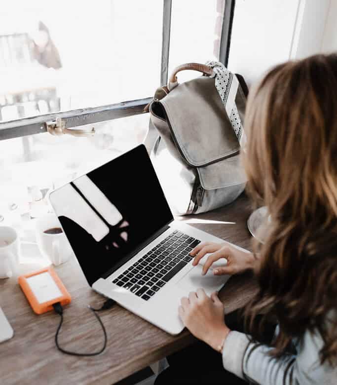 Female writer using laptop