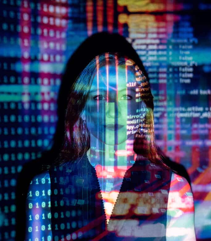 Woman illuminated by data