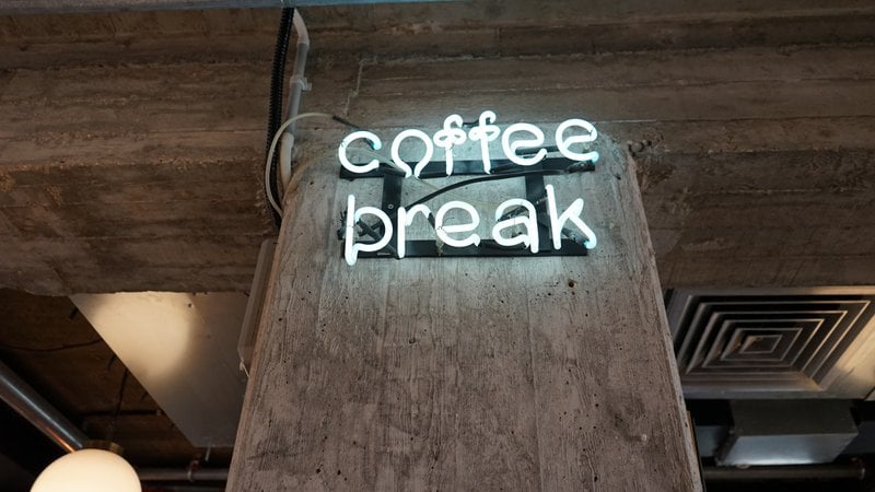 neon sign saying coffee break